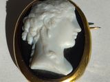 a picture of a woman ' s head in a black and white broochle