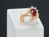 an image of a diamond and ruby ring on display in a box