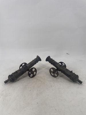 pair of antique cast iron cannon wheels on wheels
