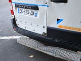 a white van parked on the side of the road