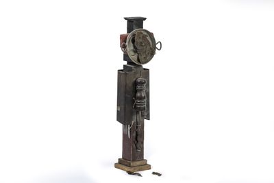 a sculpture of a clock on a stand with a clock on it