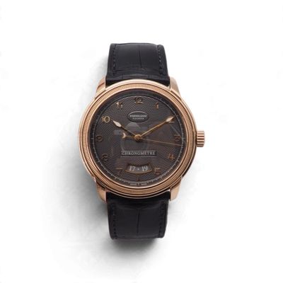 une image d'un gros plan d'une montre-bracelet sur une surface blanche