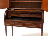 a small wooden desk with a drawer on top of it