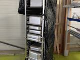 a picture of a kitchen area with a cart full of plates and pans