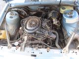 a picture of a car engine with its hood open