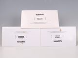 two white envelopes sitting on top of each other on a table