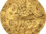 a gold coin with an image of a man on a horse