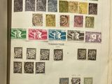 an open book with a lot of stamps on it