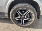 a close up of a car ' s tire on the road