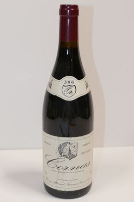 a bottle of wine that is sitting on a table