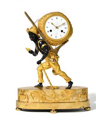 a statue of a man carrying a clock on his back