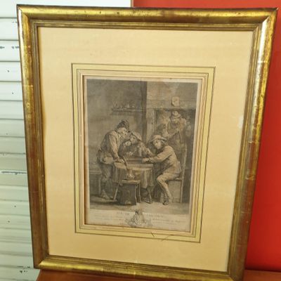 an old picture of a group of men sitting around a table