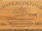 a wooden box with a label on it that says chateau olivierer