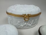 a white box with a gold decoration on it