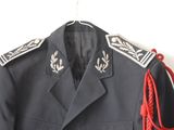 uniform of a man with a red rope on a hanger