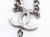 chanel necklace with a chain and a pendant with a logo