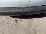 a car that has been damaged and is sitting in the parking lot