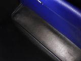 a blue speaker sitting on top of a black table