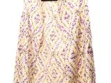 an image of a jacket hanging on a hanger on a white wall