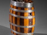an image of a wooden barrel with metal straps on a grey background