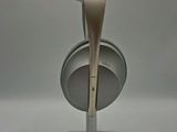 a white headphone on a stand on a white surface