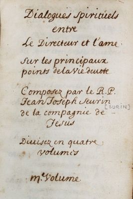 an old book with writing on it sitting on a table