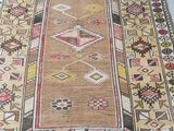 an image of a rug on the floor with a cat laying on top of it