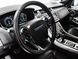 the interior of a car with a steering wheel and dashboard controls
