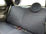 a seat in the back of a car with a cup holder on it