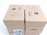 several boxes are stacked on top of each other on a white surface