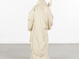 an image of a statue of a man in a white robe