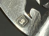 a close up of a metal object with a cat on it