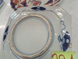 a white plate with a blue and red design on it