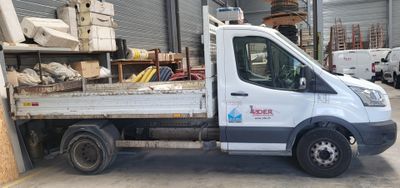 a white truck that is parked in a warehouse