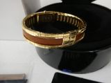 a bracelet that is sitting on top of a black box
