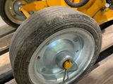a yellow machine that is sitting on a pallet
