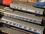 a lot of toy trains that are on a table