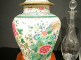 a vase and a decanter sitting on a table