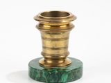 an image of a green and gold candle holder on a white background