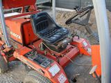 a tractor that is sitting on the ground in the dirt