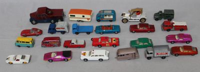 a lot of toy cars and trucks that are on the table