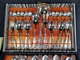 many silver spoons and spoon spoons in a case