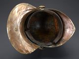 a close up of a metal object on a black surface