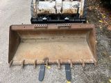 a small bulldozer that is parked on the side of the road