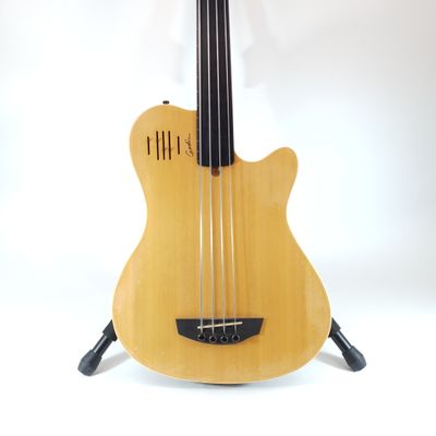 a guitar that is sitting on a stand on a white background