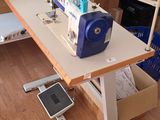 a sewing machine sitting on a table in a room