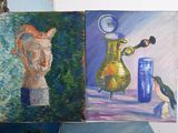 three paintings of cats and a bird on a table