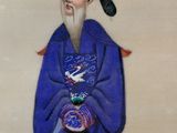 painting of a man in a blue robe and hat holding a bowl