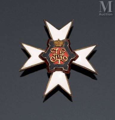a badge with a crown on it on a black surface