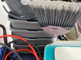 a lot of cleaning supplies that are on top of a table